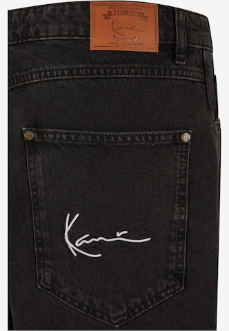 Tapered Jeans di Karl Kani in nero