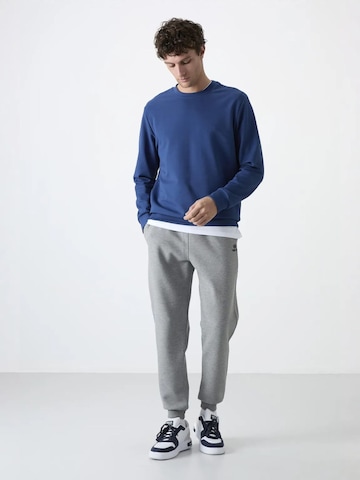 Tommy Life - Skinny Calças de desporto 'Jogginghose' em cinzento