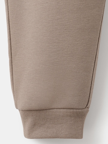 MANGO KIDS Дънки Tapered Leg Панталон в кафяво