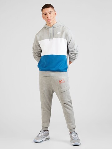 Nike Sportswear Alt kitsenev Klapptaskutega püksid, värv hall