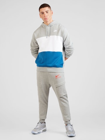 Effilé Pantalon cargo Nike Sportswear en gris