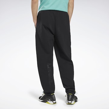 Reebok - Tapered Pantalón deportivo 'Les Mills®' en negro