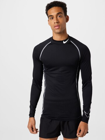 T-Shirt fonctionnel NIKE en noir : devant