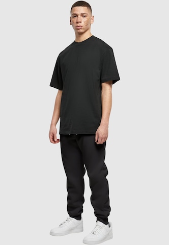 Loosefit Pantaloni di SOUTHPOLE in nero