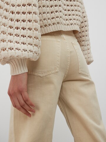 Wide leg Jeans 'Avery' di EDITED in beige