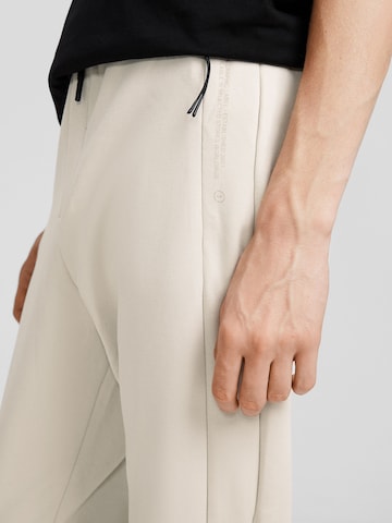 Bershka Tapered Hose in Beige