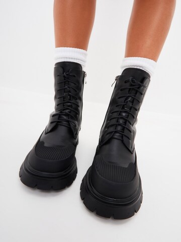 CESARE GASPARI Lace-Up Ankle Boots in Black