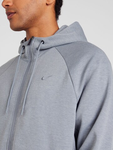 NIKE Спортивная кофта 'PRIMARY' в Серый