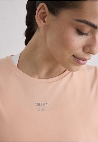 Haut de sport Aim'n en orange