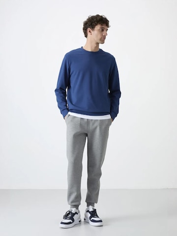 Tommy Life - Skinny Calças de desporto 'Jogginghose' em cinzento