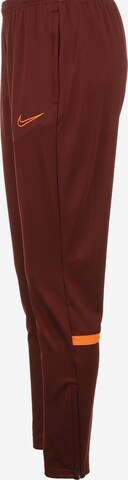 NIKE Skinny Workout Pants in Brown