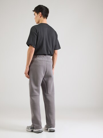 Nike Sportswear Loosefit Παντελόνι 'TECH FLC' σε γκρι