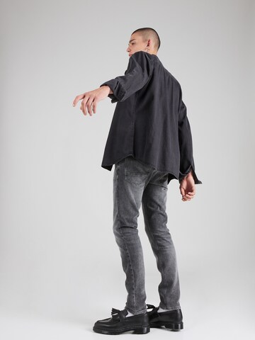 Slimfit Jeans 'Skim' di SCOTCH & SODA in grigio