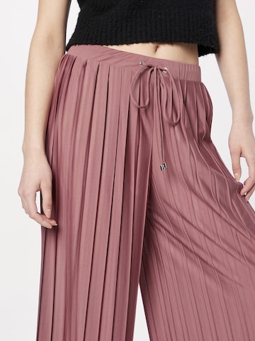 ABOUT YOU Wide Leg Housut 'Caren Trousers' värissä vaaleanpunainen