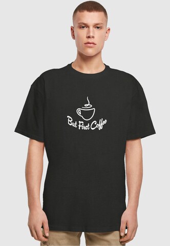 Merchcode Shirt 'But First Coffee' in Zwart: voorkant