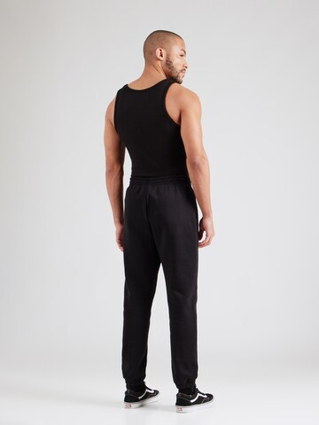 Champion Authentic Athletic Apparel Tapered Broek in Zwart