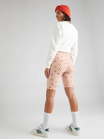 Skinny Pantaloni 'FLYING' di VANS in arancione