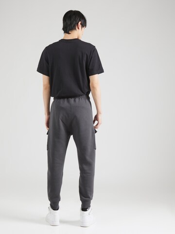 Nike Sportswear Zwężany krój Bojówki 'AIR' w kolorze szary