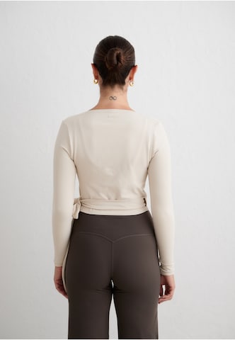 Aim'n - Blusa funcionais em bege