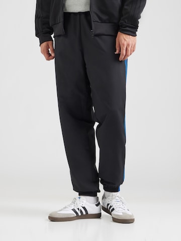 Tapered Pantaloni 'BRUSHED' di ADIDAS ORIGINALS in nero: frontale