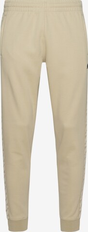 Coupe slim Pantalon de sport Superdry en beige : devant