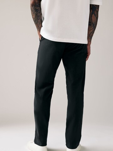 Loosefit Pantaloni chino di Next in nero