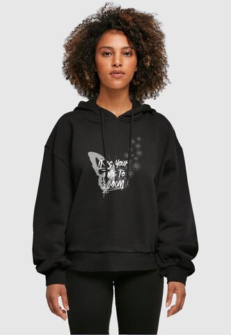 Merchcode Sweatshirt 'Its Your Time To Bloom' in Zwart: voorkant