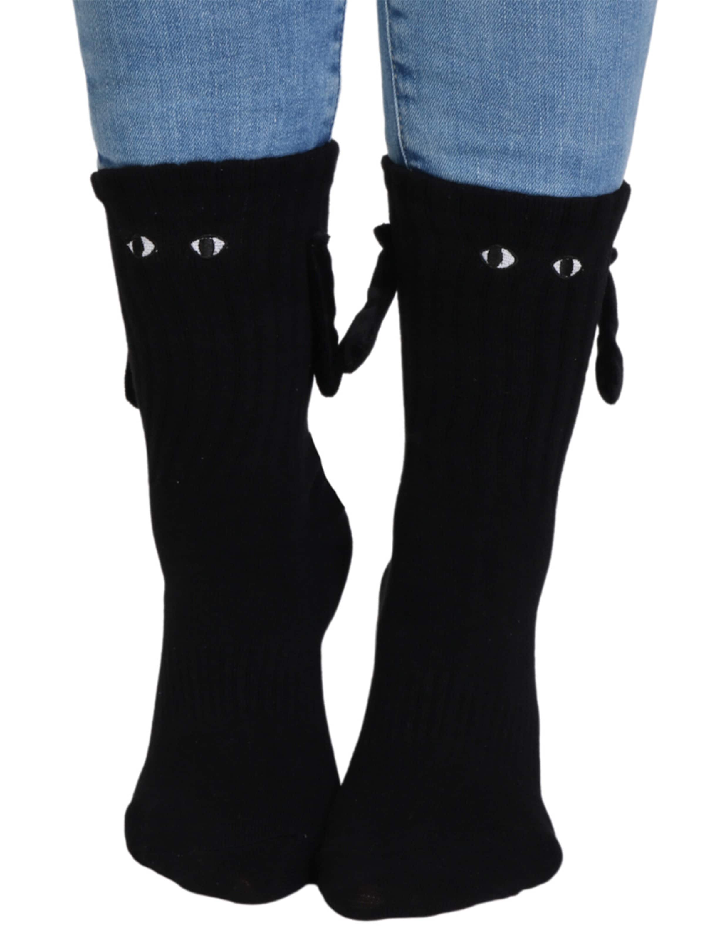 Sokisahtel Sokken 'MAGNET socks with magnetic hands' in Zwart: voorkant