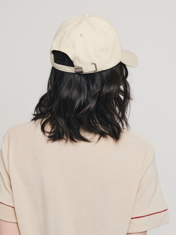 Casquette 'MEMBER' UNFOLLOWED x ABOUT YOU en beige : derrière