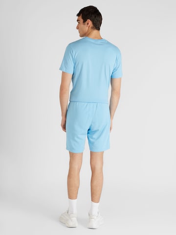 regular Pantaloni di Champion Authentic Athletic Apparel in blu