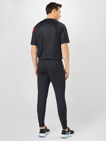 NIKE Slimfit Spodnie sportowe 'Strike' w kolorze czarny
