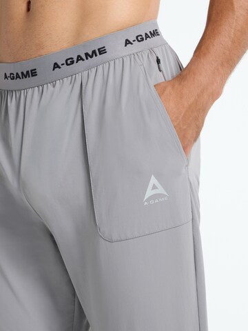 regular Pantaloni sportivi di A-Game in grigio