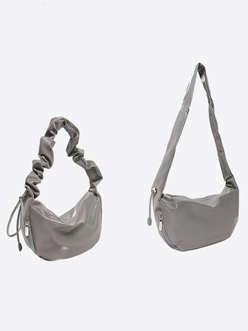 Magicshe Schultertasche‌ in Grau