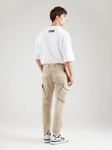 Tapered Pantaloni cu buzunare 'Combat' de la ALPHA INDUSTRIES pe bej