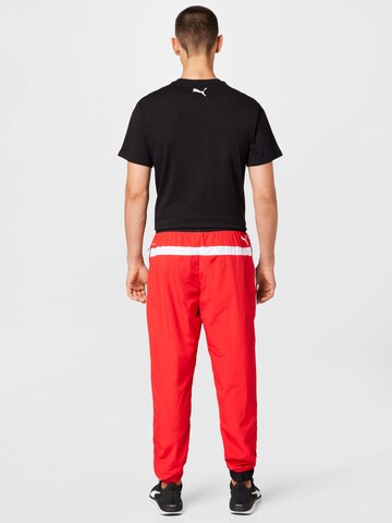 Effilé Pantalon de sport 'Clyde' PUMA en rouge