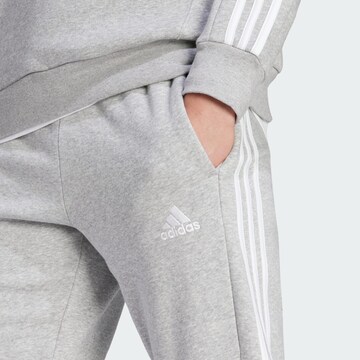 ADIDAS SPORTSWEAR Tapered Urheiluhousut 'Essentials' värissä harmaa