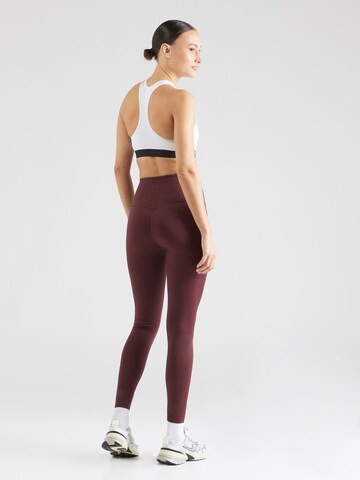 NIKE Skinny Workout Pants in Red