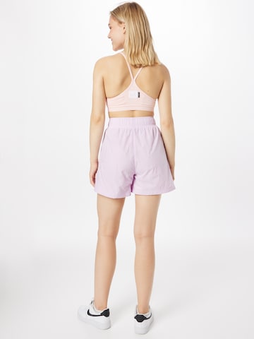 Wide leg Pantaloni de la Nike Sportswear pe roz