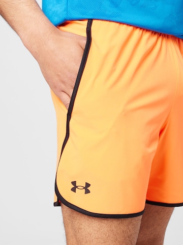 Regular Pantalon de sport UNDER ARMOUR en orange