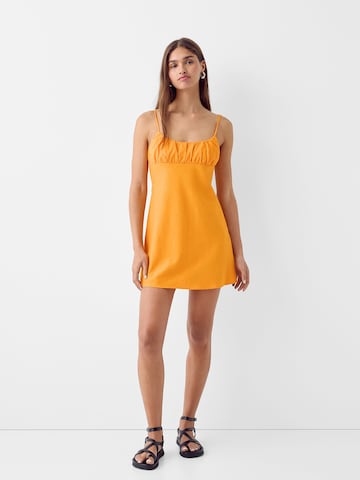 Bershka Letné šaty - Oranžová