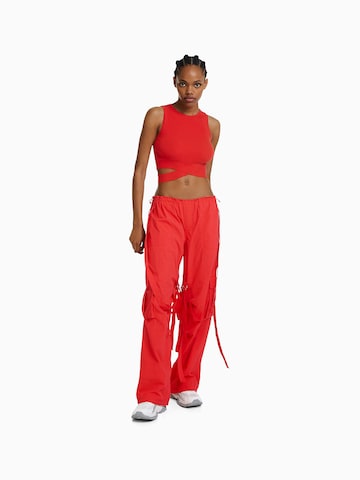 Bershka Loose fit Cargo trousers in Red