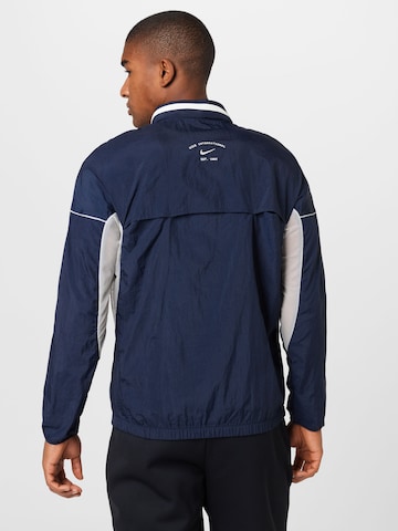 Veste de sport NIKE en bleu