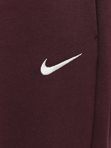 Effilé Pantalon 'Phoenix Fleece' Nike Sportswear en rouge