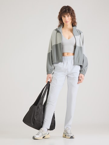 UNDER ARMOUR Tapered Παντελόνι φόρμας 'Unstoppable' σε γκρι