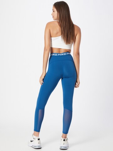 NIKE Skinny Športne hlače | modra barva