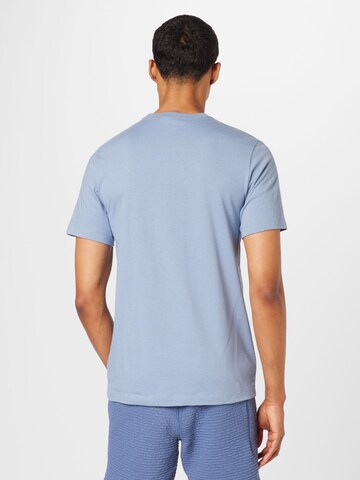 Nike Sportswear T-shirt 'Swoosh' i blå