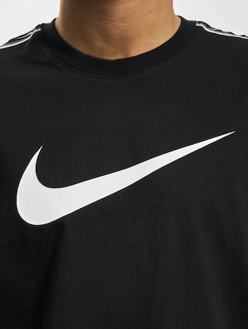Maglietta 'Repeat' di NIKE in nero