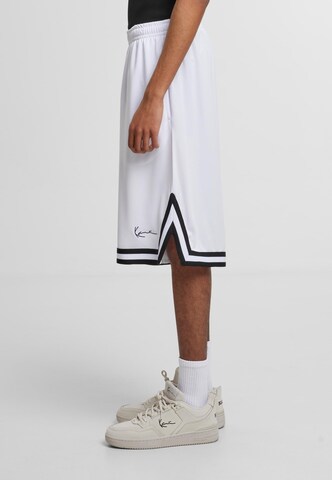 Karl Kani Loose fit Pants 'Signature' in Mixed colors
