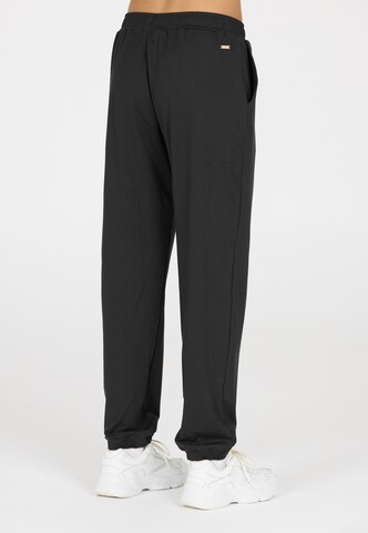 Athlecia Regular Sports trousers in Black