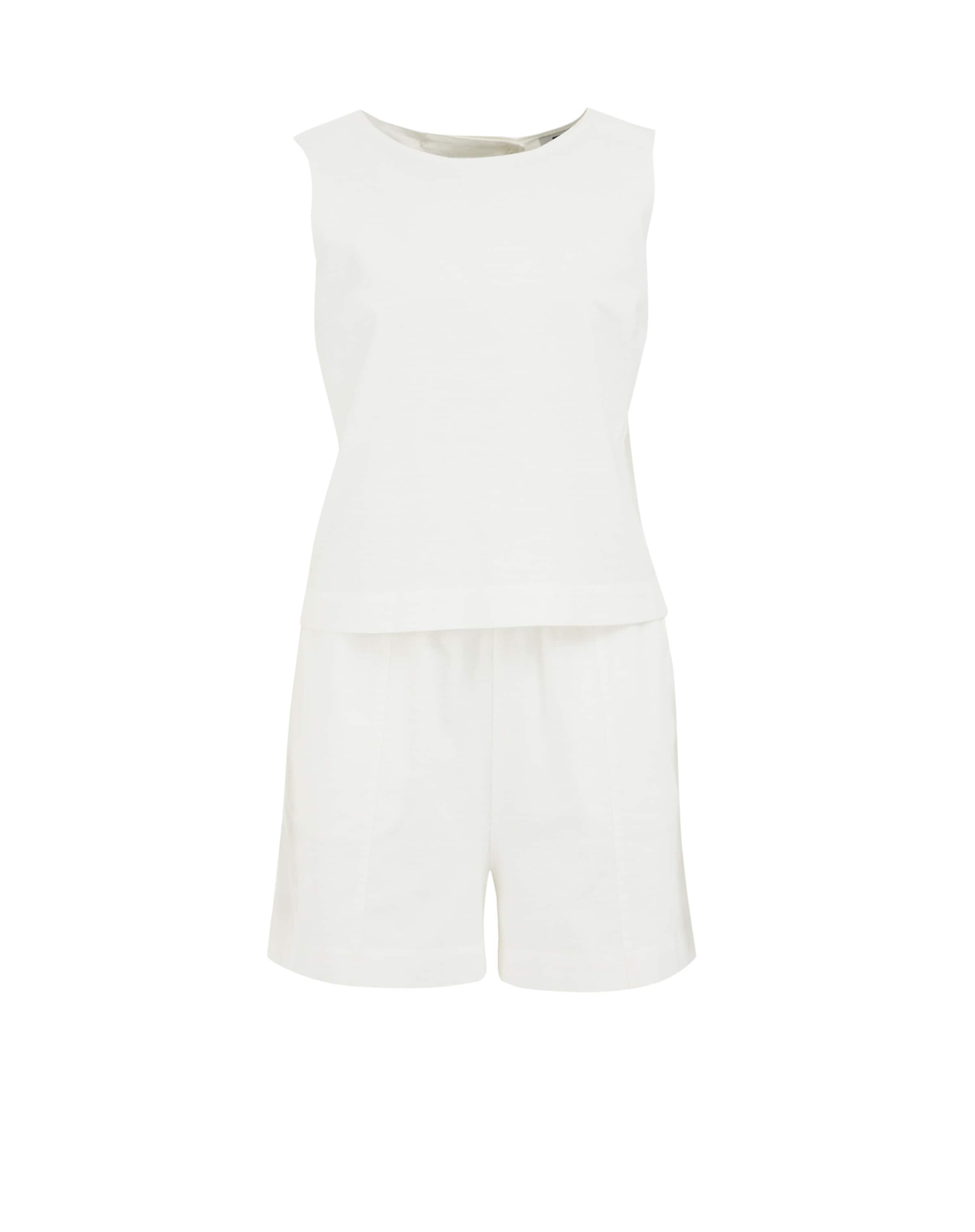 Salopeta de la WE Fashion pe alb: față